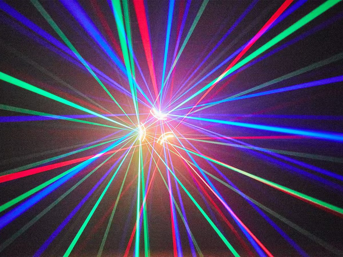 Colourful beam effect over an event stage floor