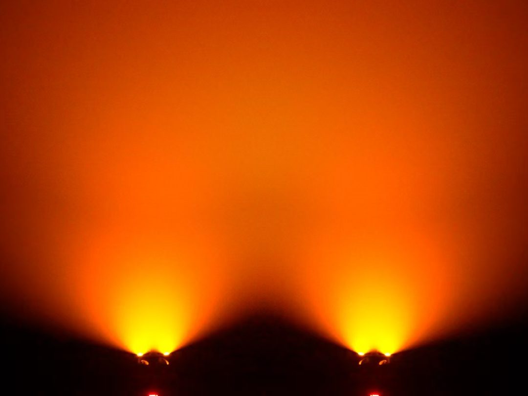 Warm amber light wash on an interior wall